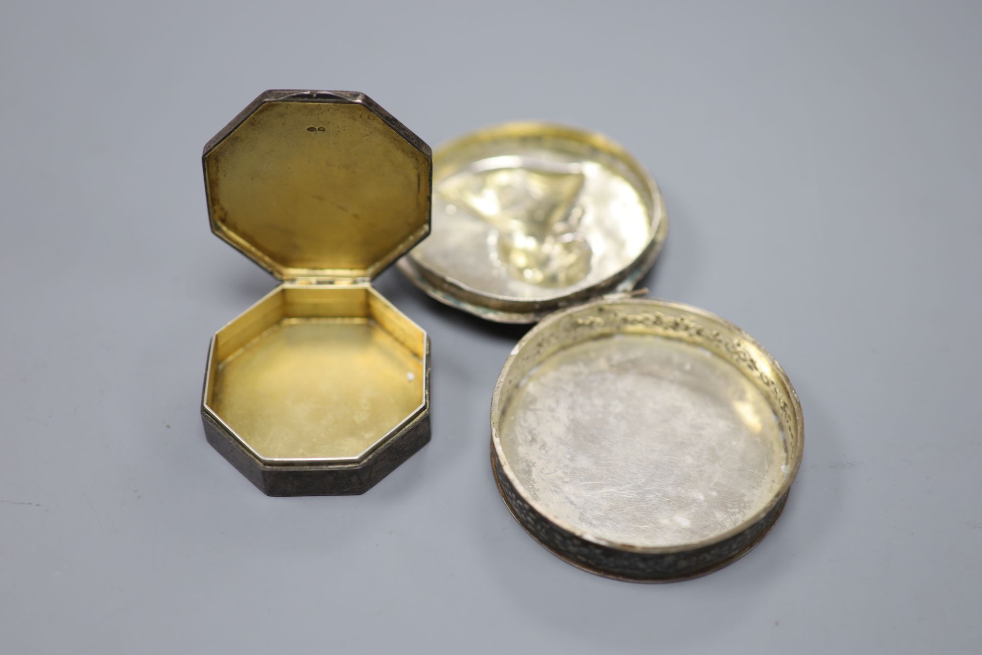 A late 19th century Hanau silver circular snuff box, import marks for London, 1899, 71mm and a later silver box.